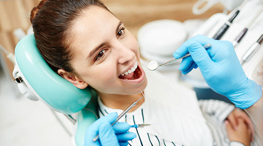 dentist treating female patient